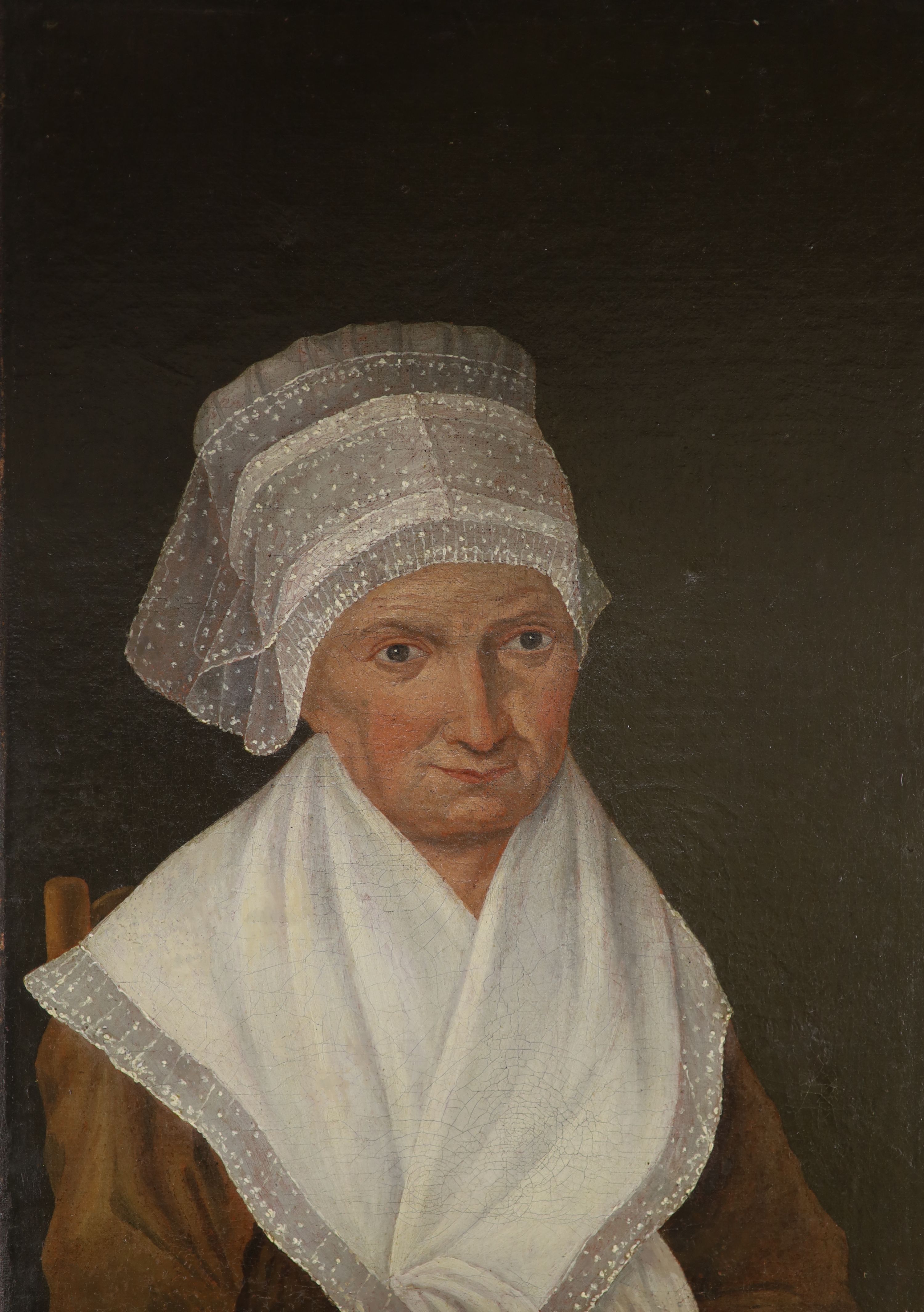 19th century Dutch school, oil on canvas, Portrait of a lady wearing a lace bonnet, 39 x 28cm, unframed